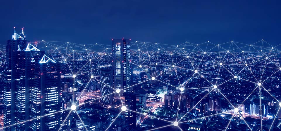 Graphical depiction of 5G technologies connecting complex networks across a city scape. 