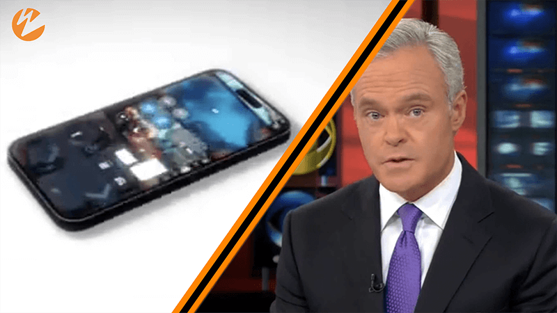 New reporter next to image of a cellphone