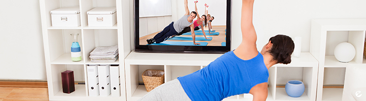 Woman live streaming a yoga class at home