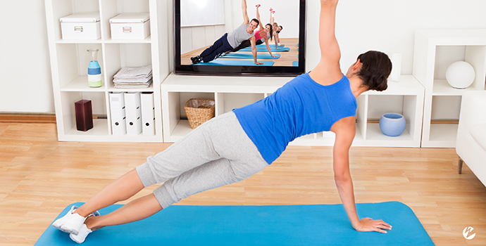 Woman live streaming a yoga class at home