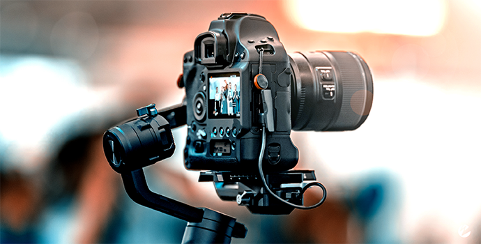 A camera on a tripod capturing a live video stream.