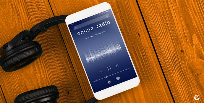Live audio stream playing on a mobile phone with title 'online radio' and a radio station UI.
