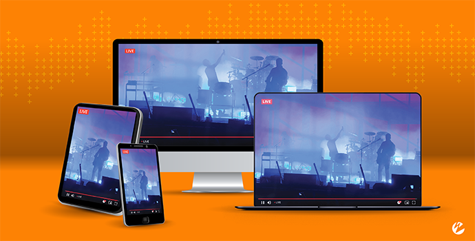 A tablet, smart phone, laptop, and desktop all displaying the same live stream of a concert.
