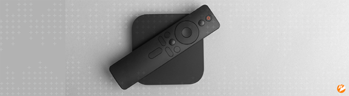 Smart TV remote on top of a modem