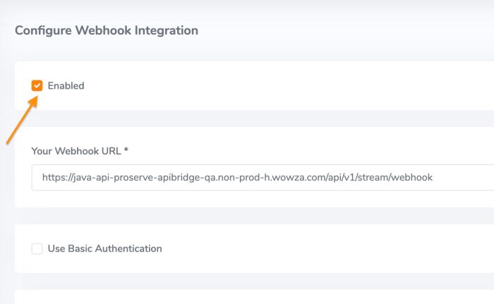 A screenshot showing how to check 'Enabled' when configuring Webhook integration in Wowza Video.